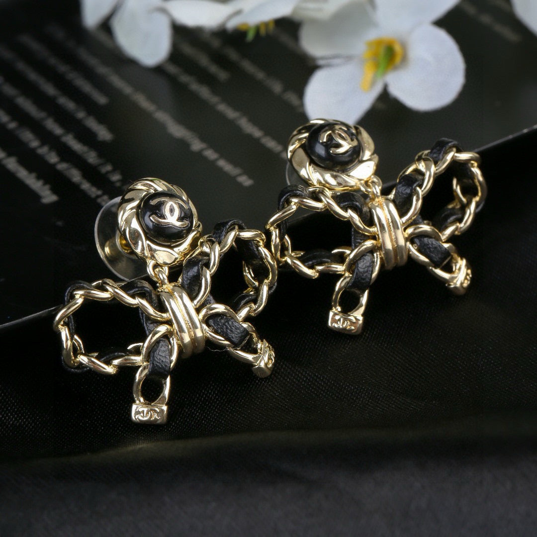 Martin Graham earrings in polished metal-tone – close-up detail