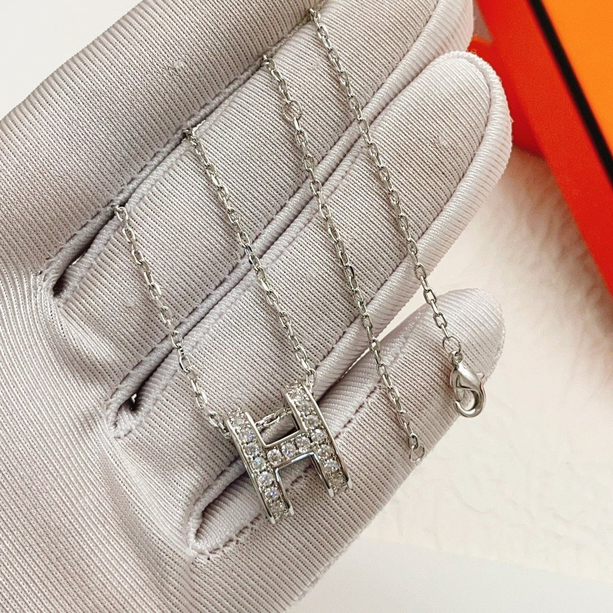 Martin Graham pendant necklace in polished metal-tone – detail view