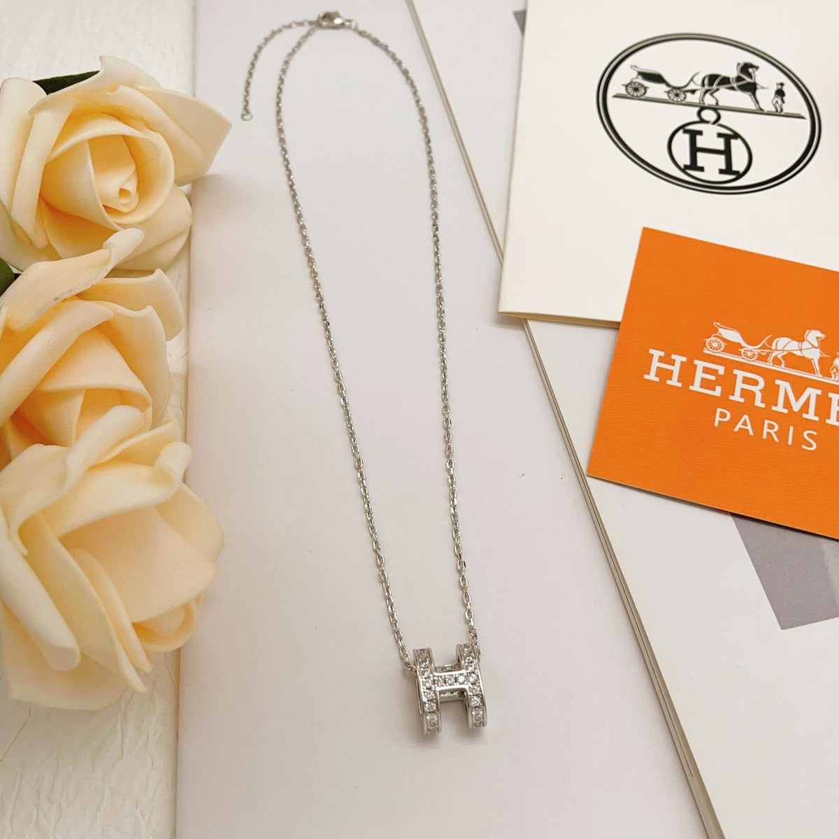 Martin Graham pendant necklace in polished metal-tone – side detail