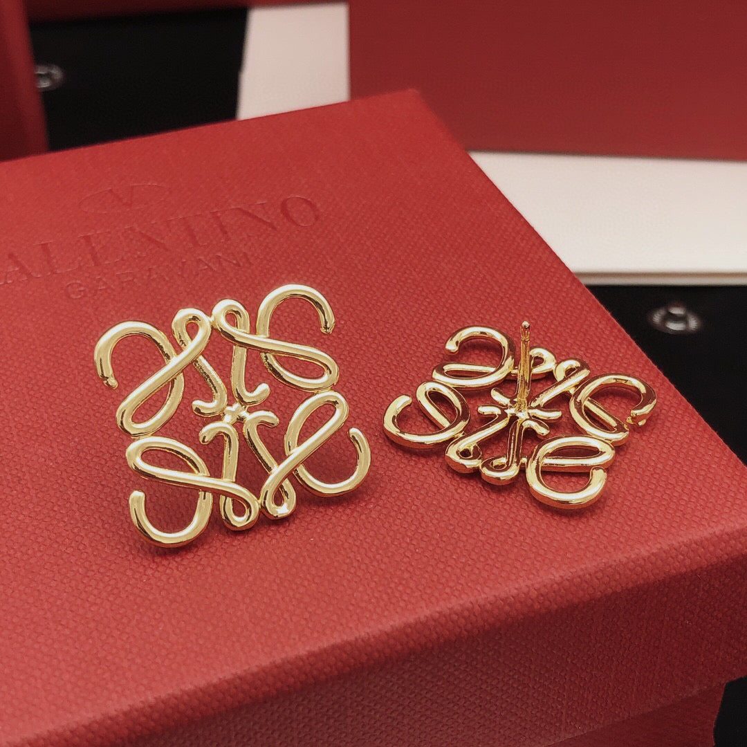 Martin Graham stud earrings in polished metal-tone – detail view