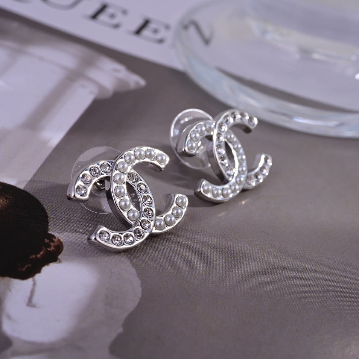 Martin Graham stud earrings in polished metal-tone – side detail