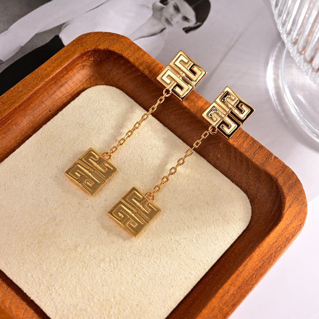 Martin Graham stud earrings in polished metal-tone – styled product view