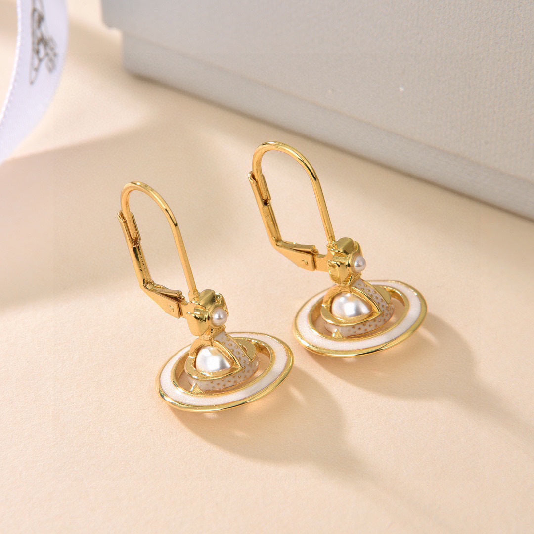 Martin Graham stud earrings in polished metal-tone – detail view