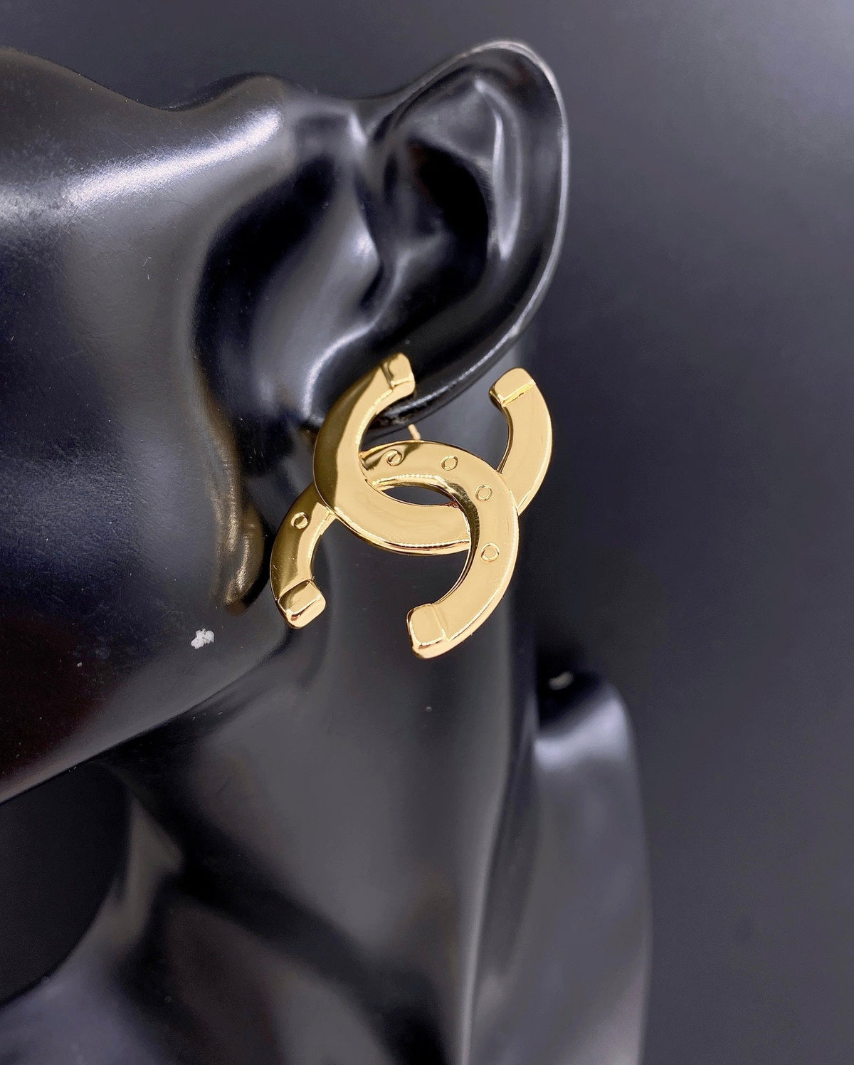 Martin Graham stud earrings in polished metal-tone – front product view