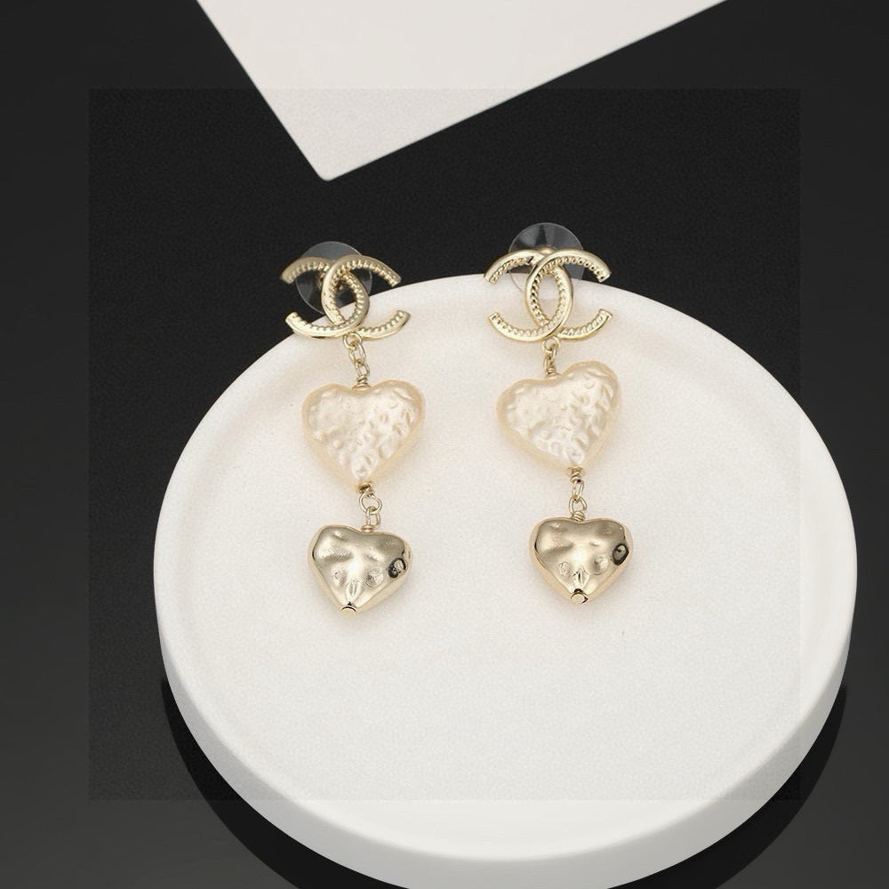 Martin Graham stud earrings in polished metal-tone – front product view