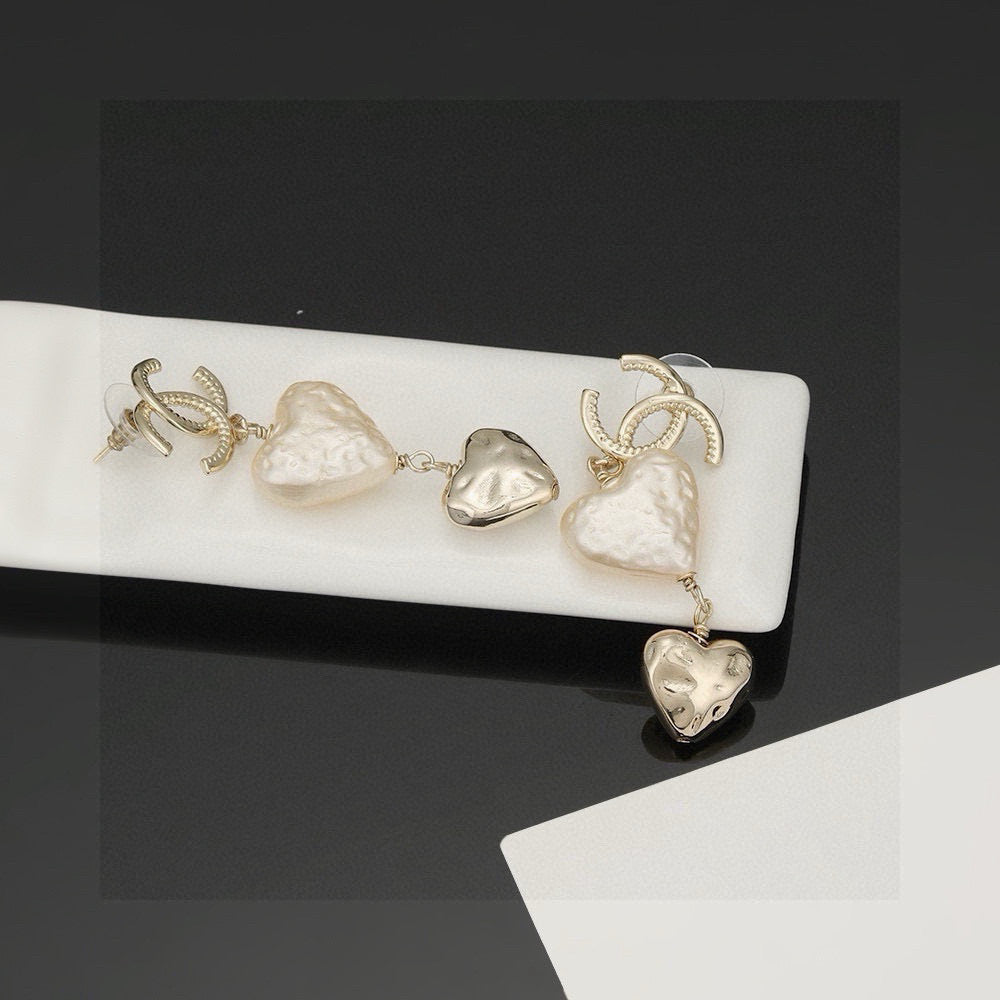 Martin Graham stud earrings in polished metal-tone – detail view