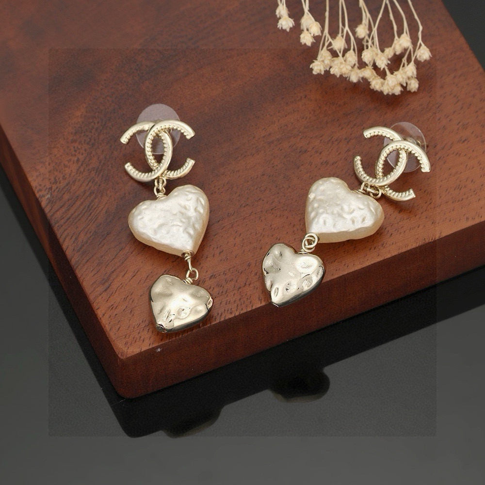 Martin Graham stud earrings in polished metal-tone – styled product view
