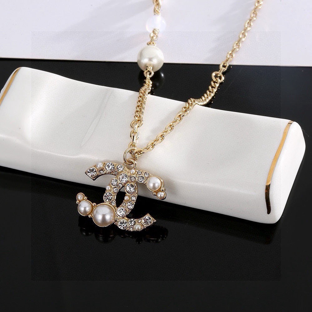 Martin Graham pendant necklace in polished metal-tone – side detail