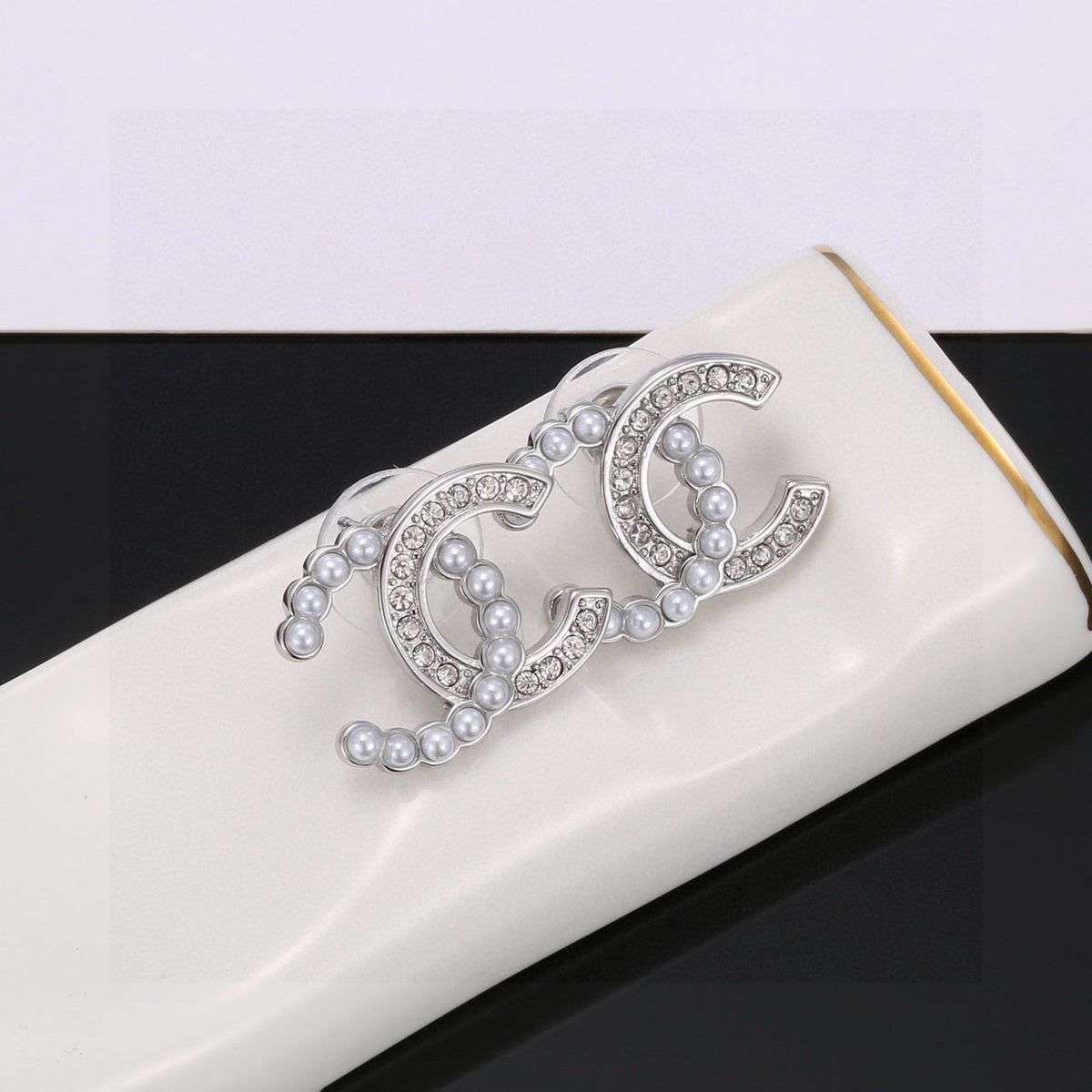 Martin Graham stud earrings in polished metal-tone – main product view