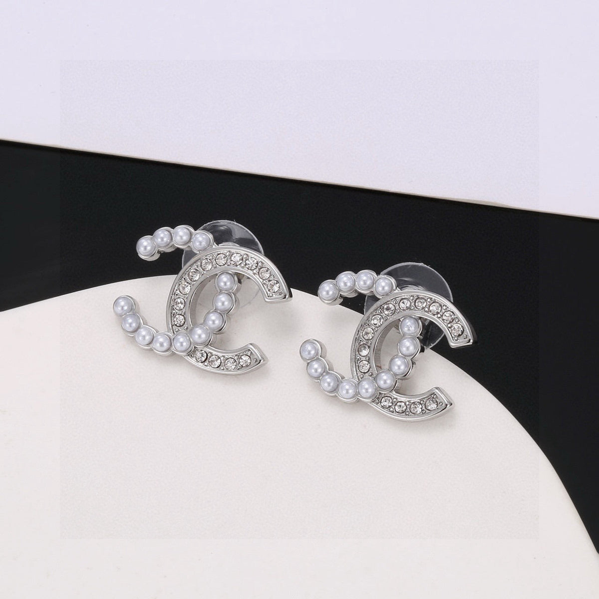 Martin Graham stud earrings in polished metal-tone – front product view