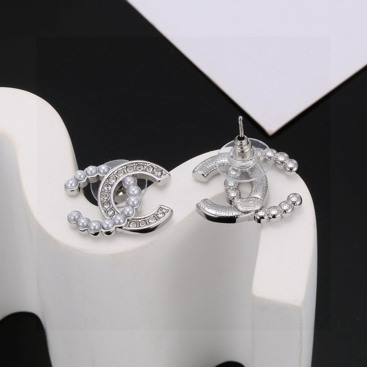 Martin Graham stud earrings in polished metal-tone – side detail