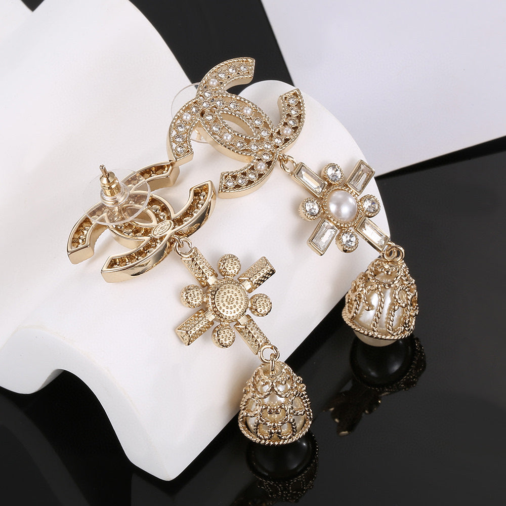 Martin Graham stud earrings in polished metal-tone – detail view