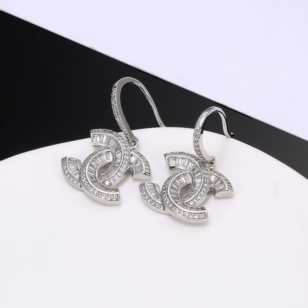 Martin Graham stud earrings in polished metal-tone – detail view