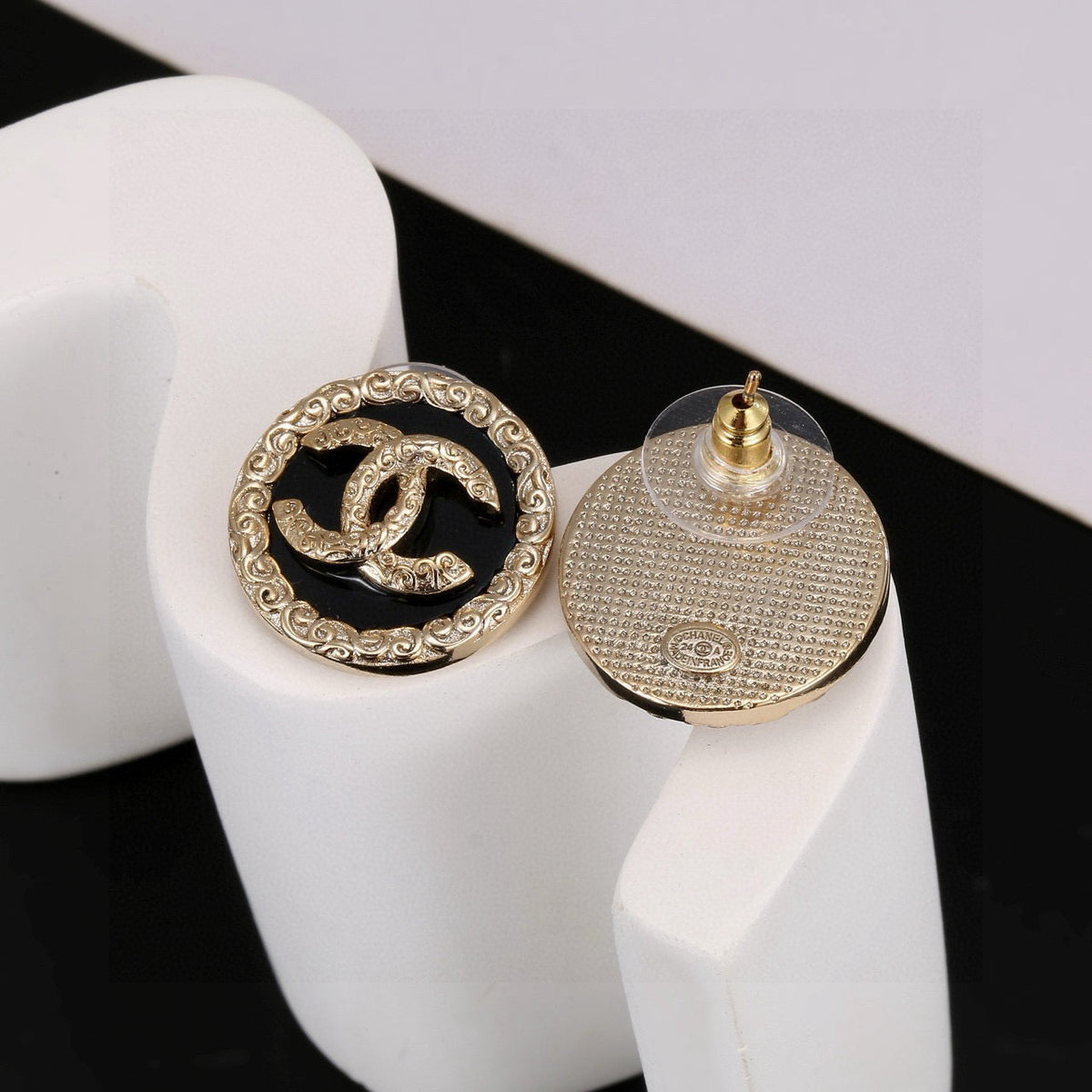 Martin Graham stud earrings in polished metal-tone – front product view