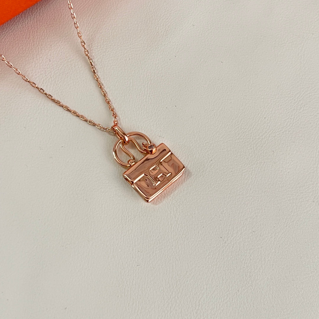 Martin Graham pendant necklace in polished metal-tone – styled product view