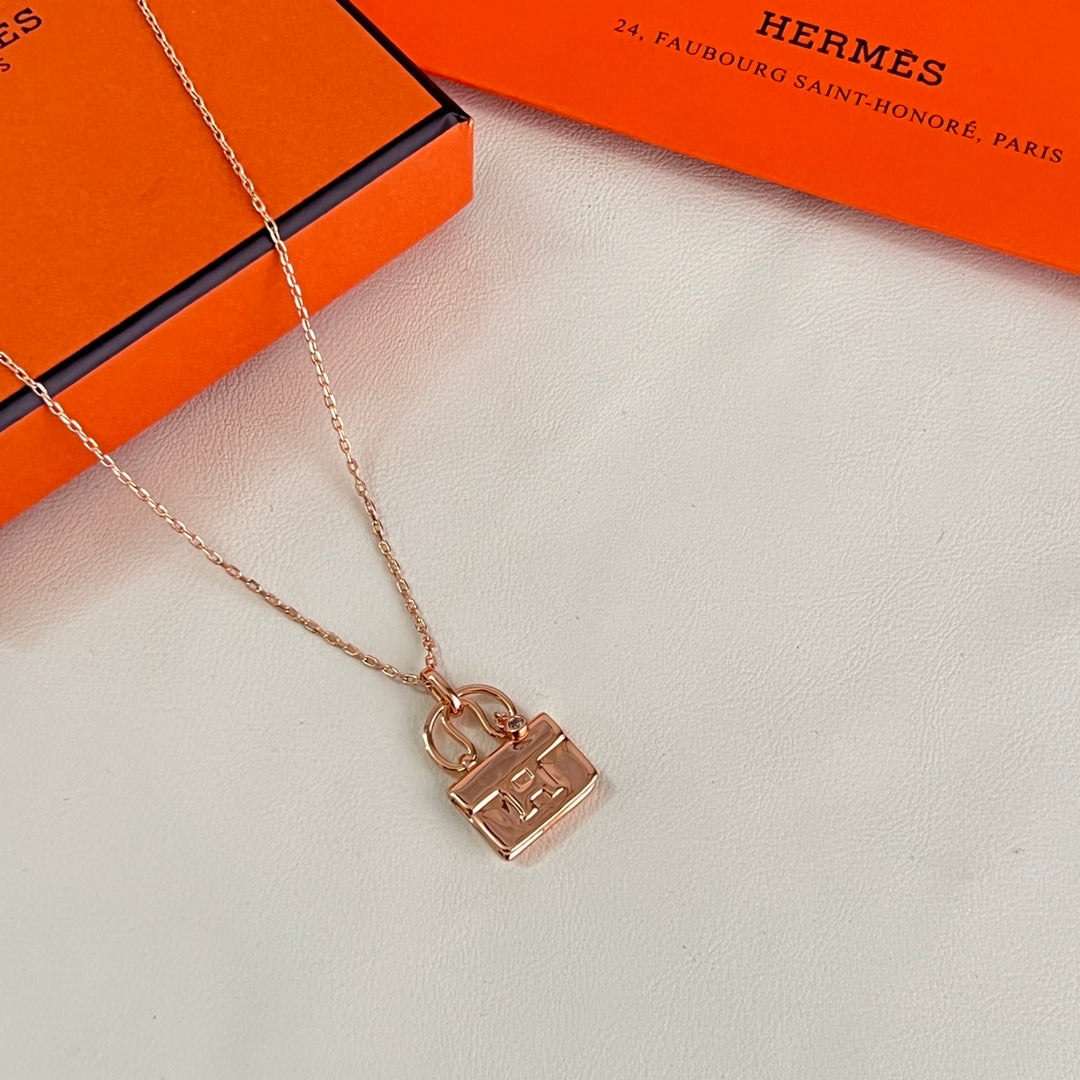 Martin Graham pendant necklace in polished metal-tone – side detail