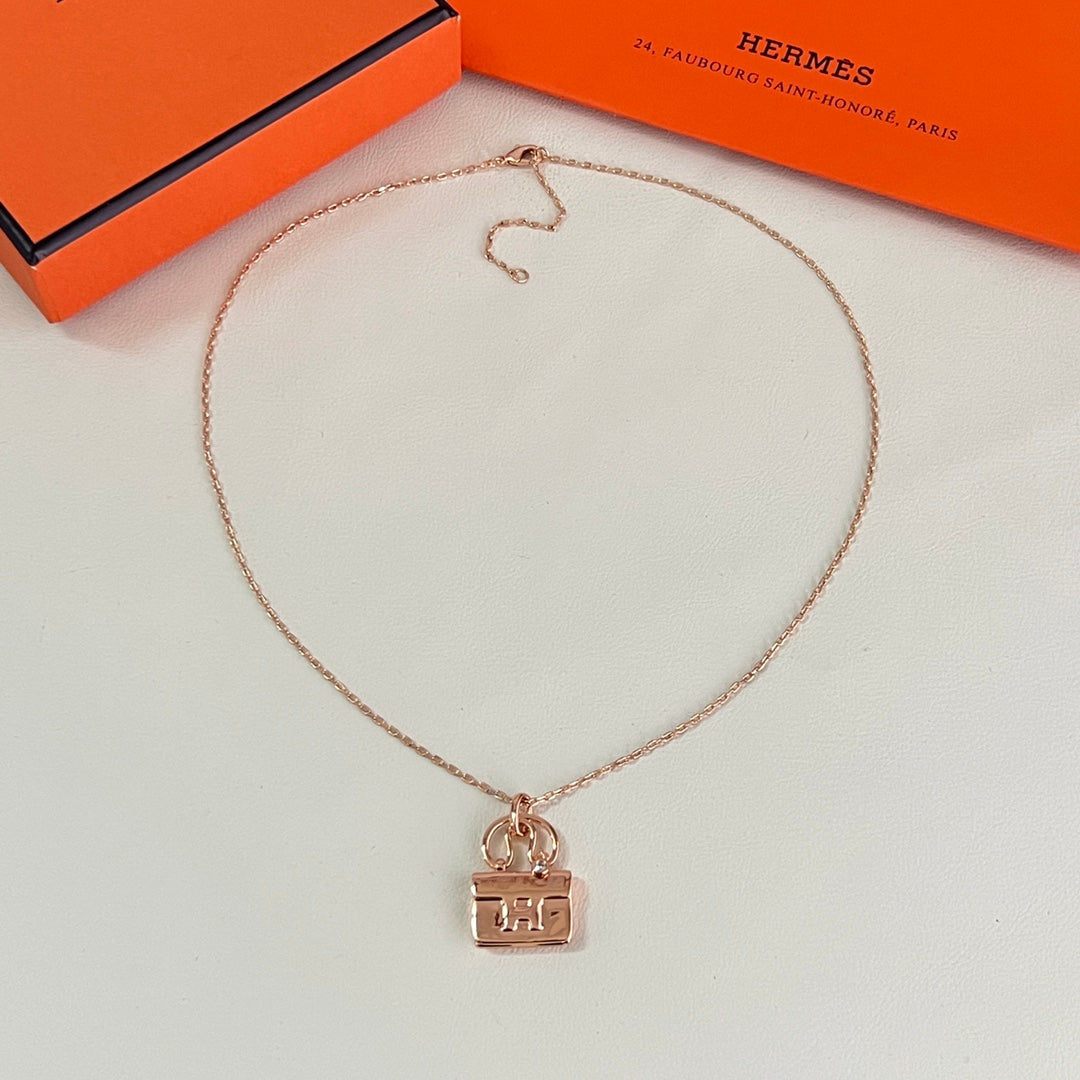 Martin Graham pendant necklace in polished metal-tone – close-up detail