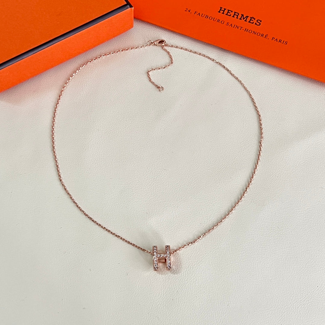 Martin Graham pendant necklace in polished metal-tone – close-up detail