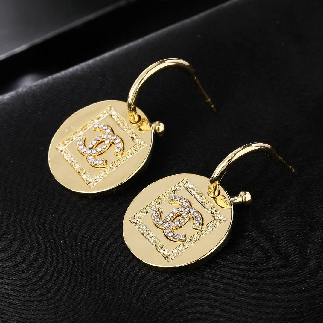 Martin Graham earrings in polished metal-tone – close-up detail