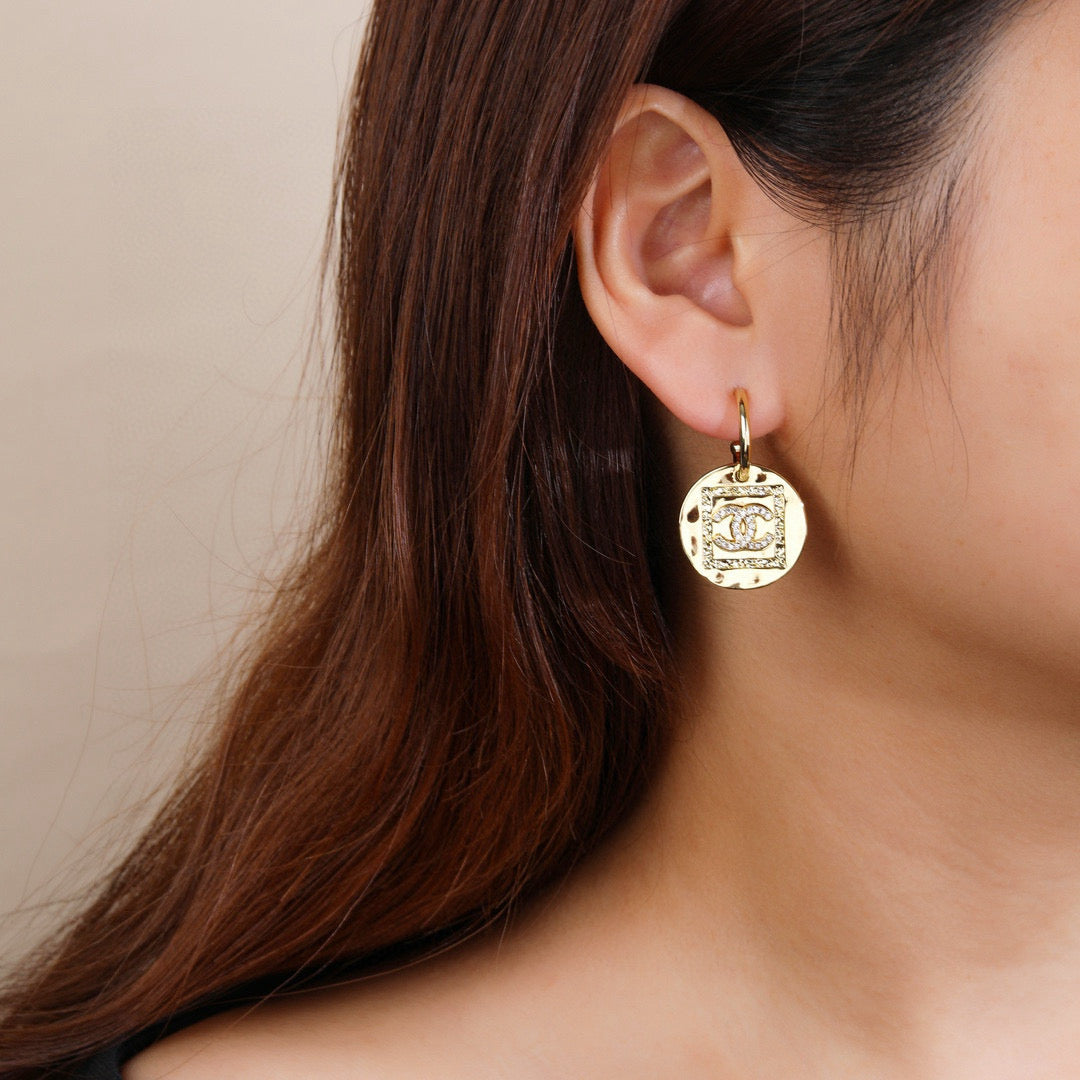 Martin Graham earrings in polished metal-tone – front product view