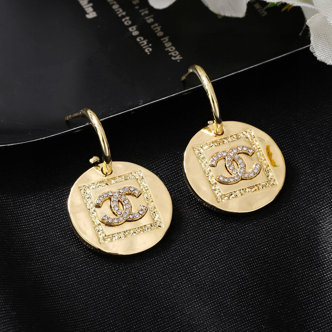 Martin Graham earrings in polished metal-tone – front product view