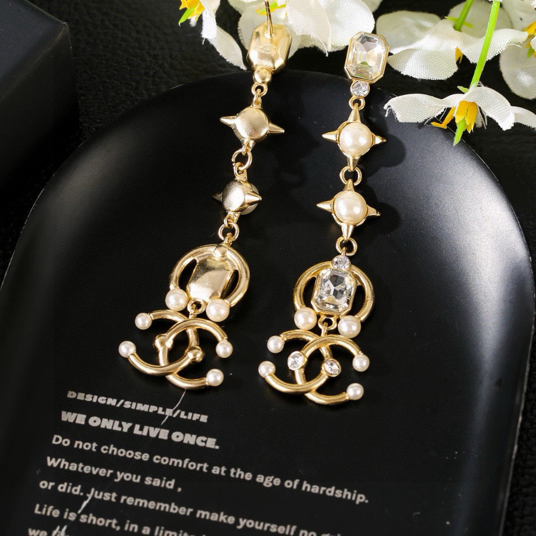 Martin Graham earrings in polished metal-tone – close-up detail