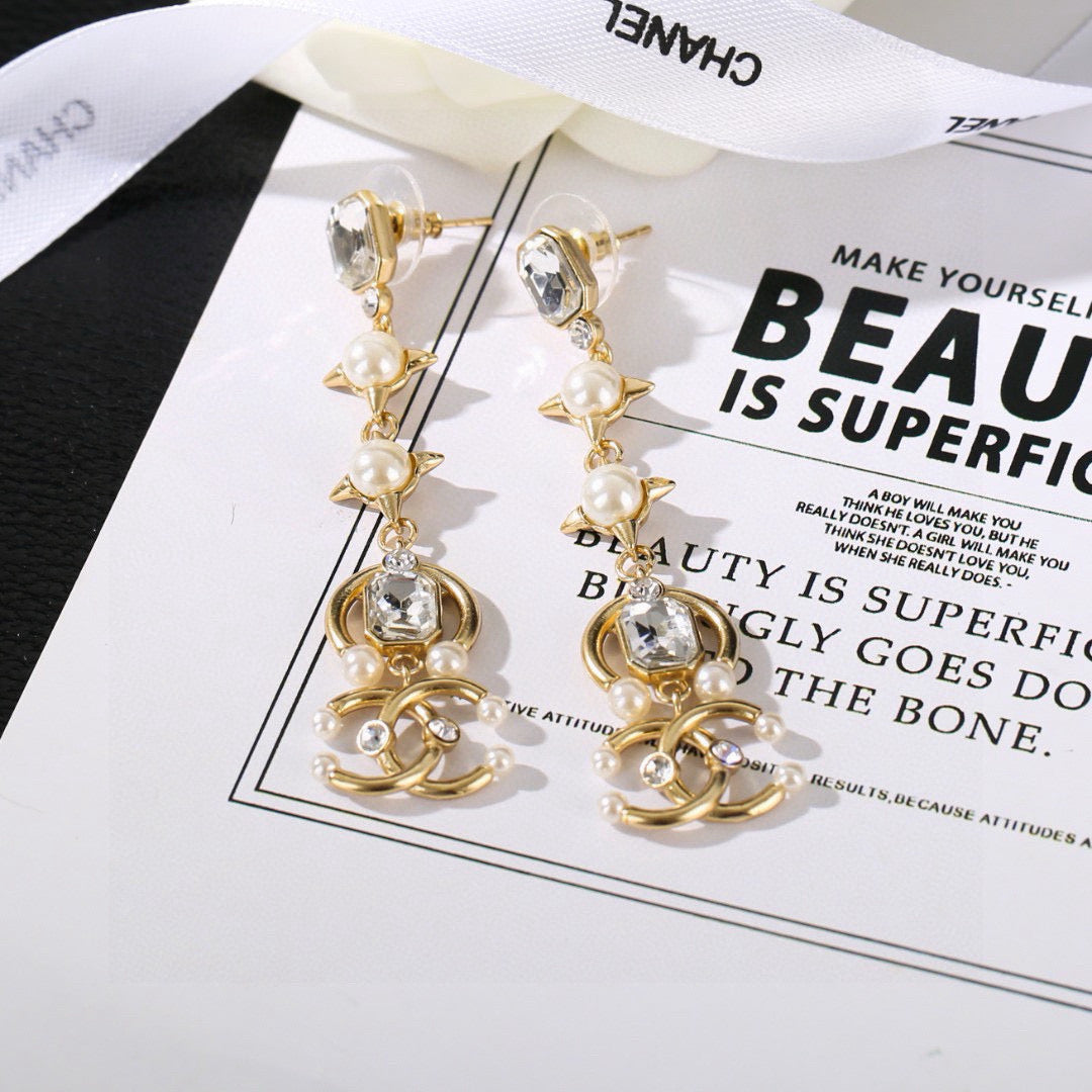 Martin Graham earrings in polished metal-tone – front product view
