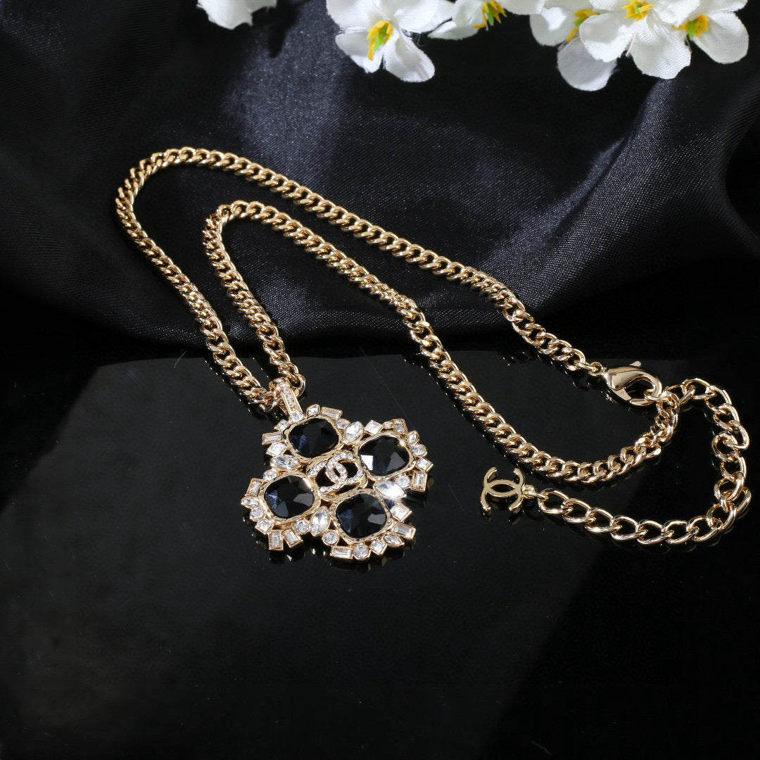 Martin Graham pendant necklace in polished metal-tone – close-up detail
