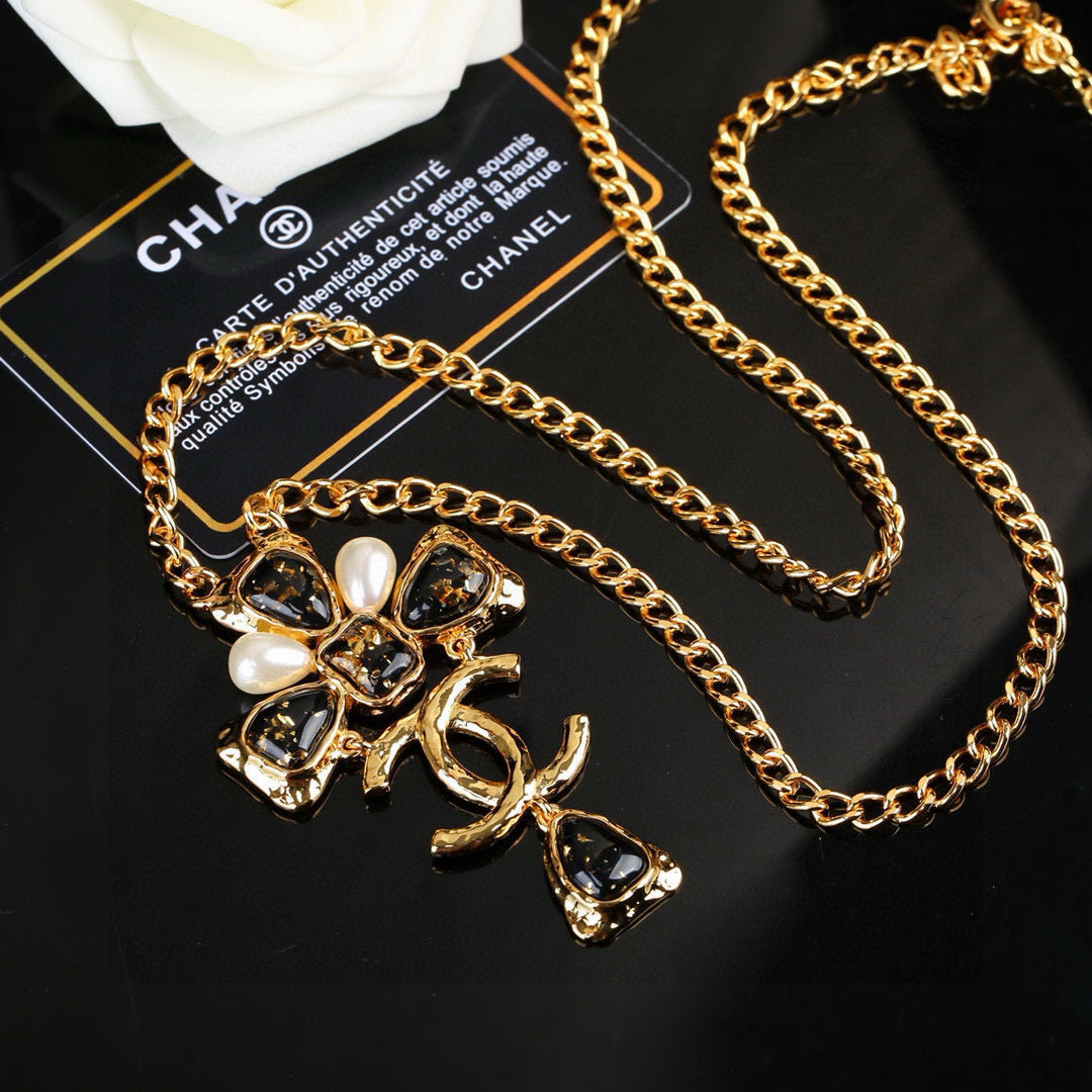 Martin Graham pendant necklace in polished metal-tone – detail view