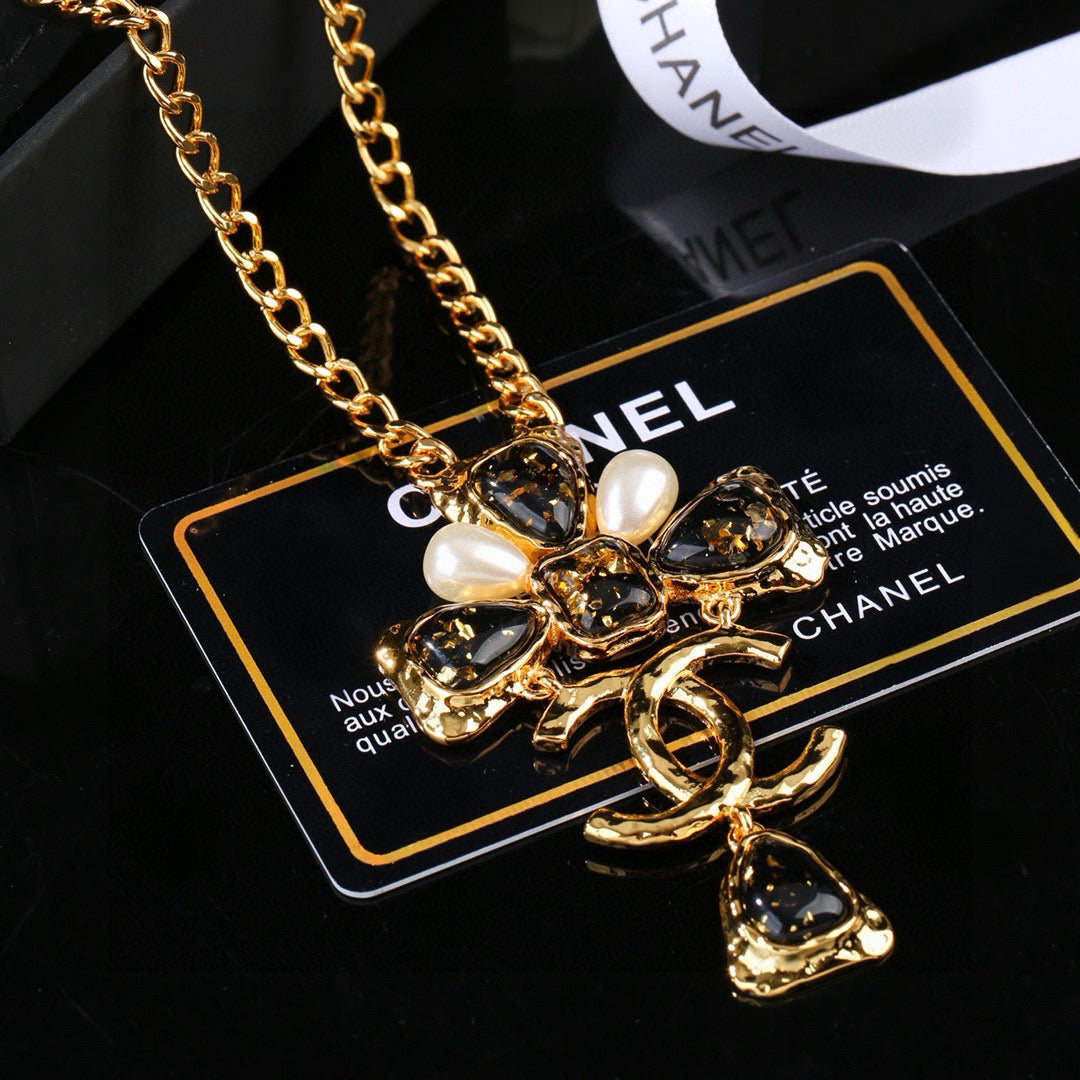 Martin Graham pendant necklace in polished metal-tone – close-up detail