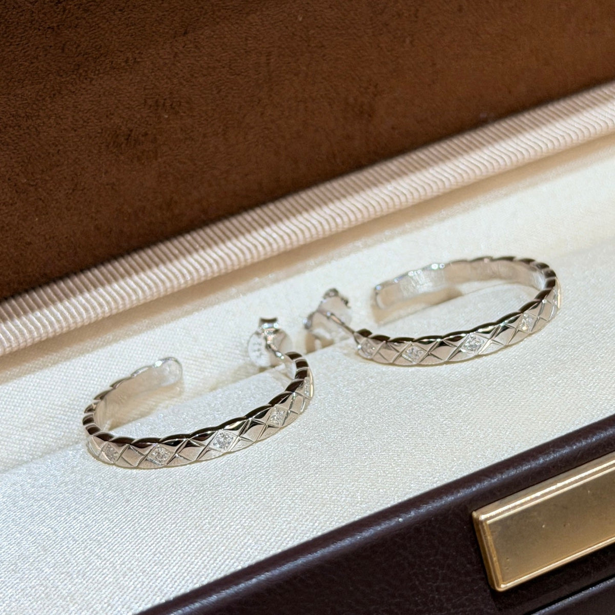 Martin Graham earrings in polished metal-tone – close-up detail
