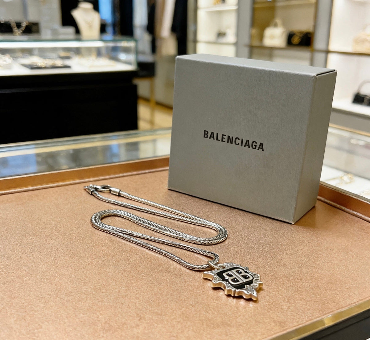 Martin Graham pendant necklace in polished metal-tone – close-up detail