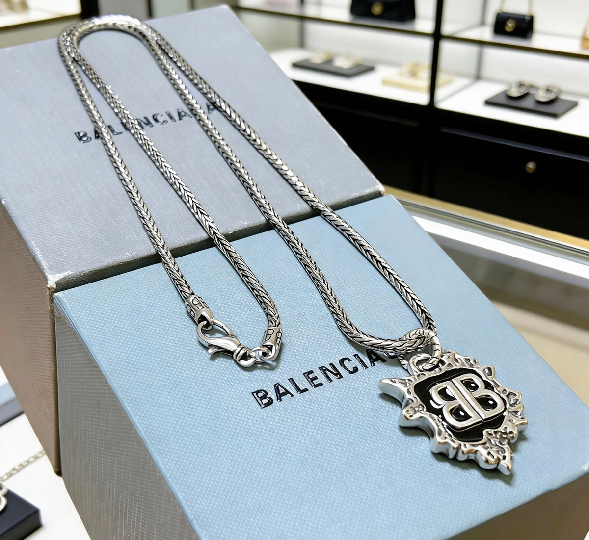 Martin Graham pendant necklace in polished metal-tone – side detail
