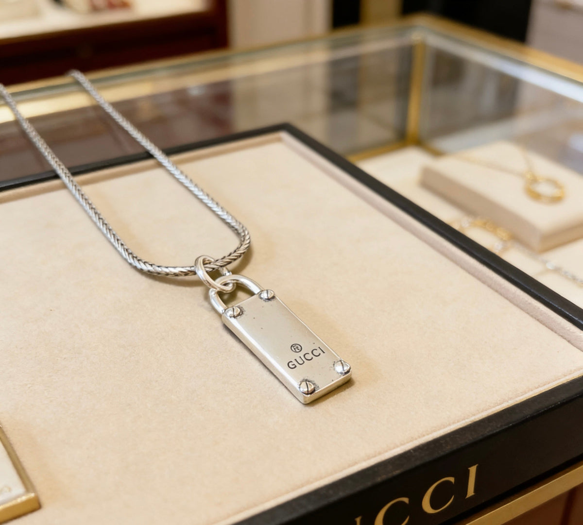 Martin Graham pendant necklace in polished metal-tone – front product view