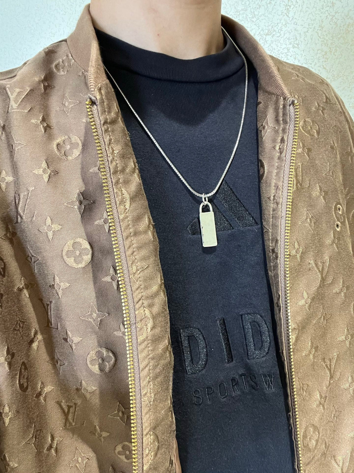 Martin Graham pendant necklace in polished metal-tone – detail view