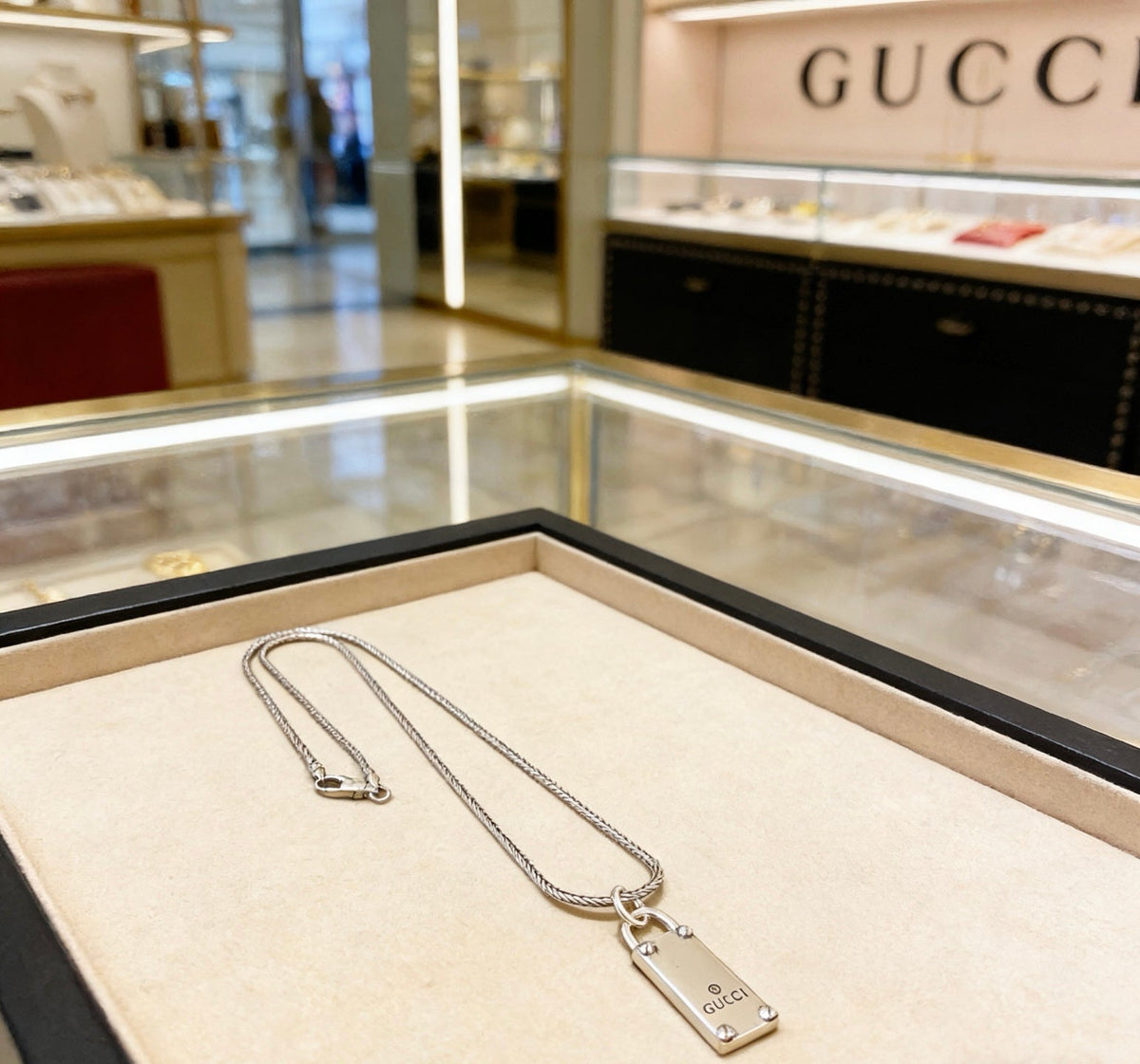 Martin Graham pendant necklace in polished metal-tone – close-up detail