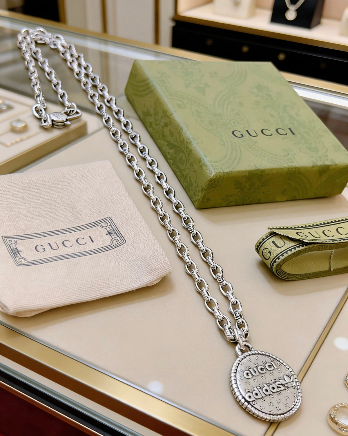 Martin Graham pendant necklace in polished metal-tone – detail view