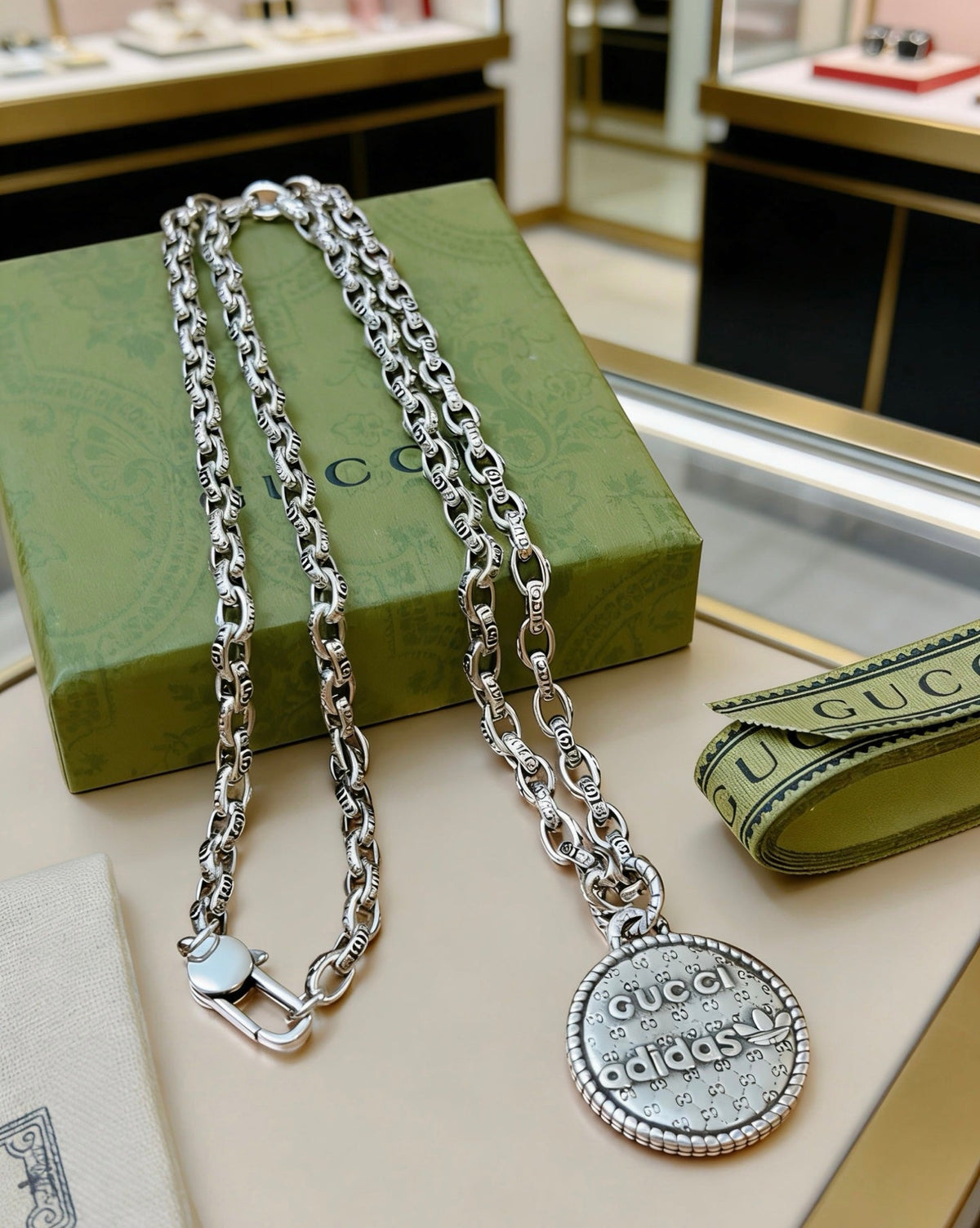 Martin Graham pendant necklace in polished metal-tone – detail view