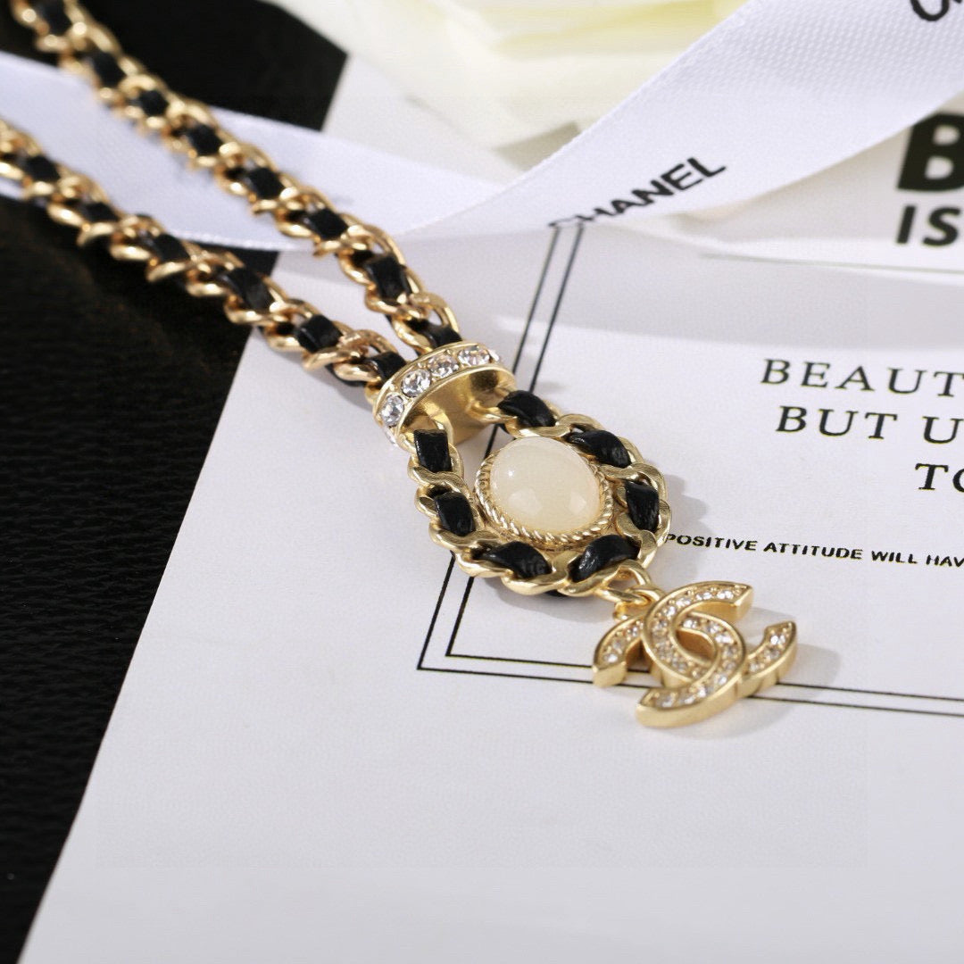 Martin Graham pendant necklace in polished metal-tone – close-up detail