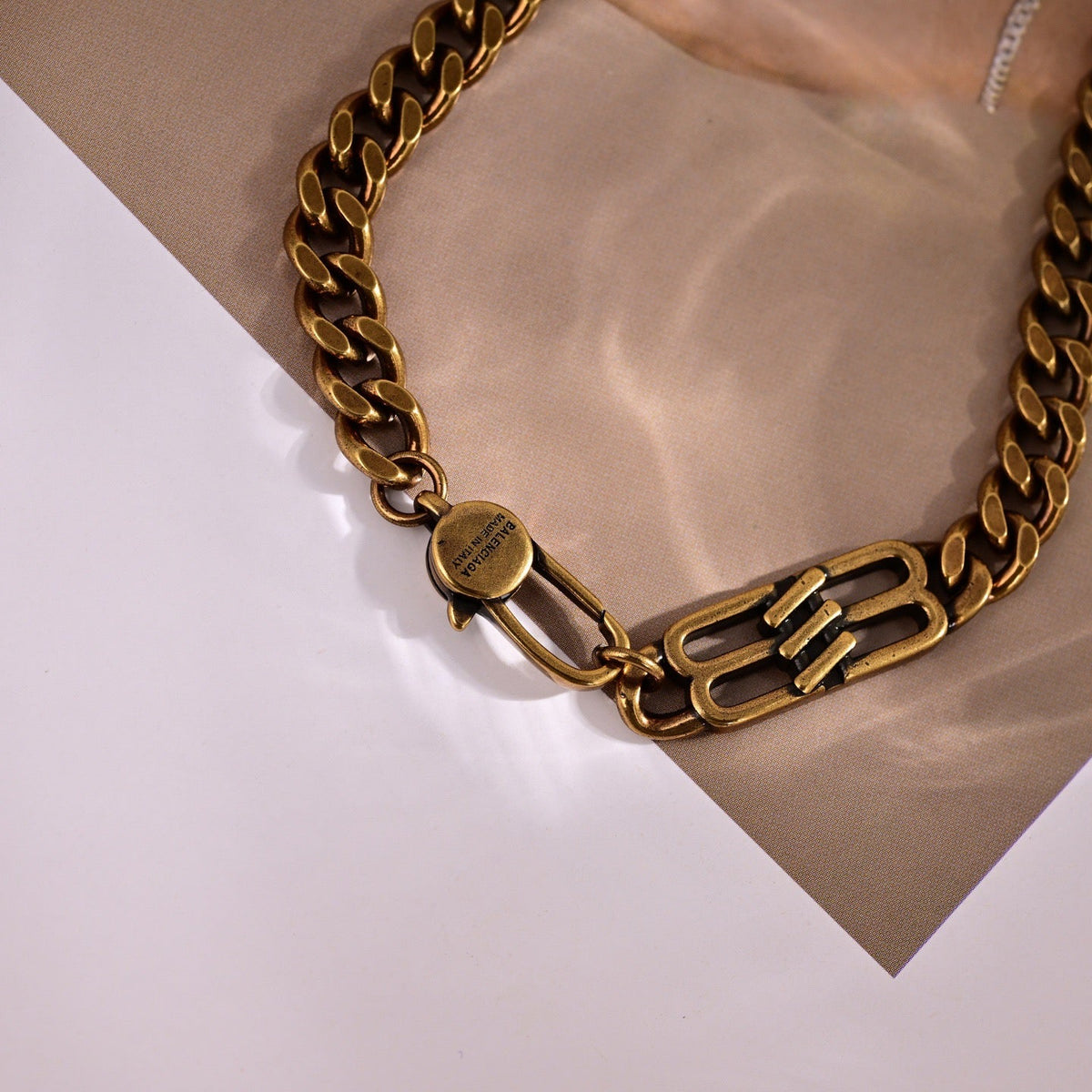 Martin Graham pendant necklace in polished metal-tone – close-up detail