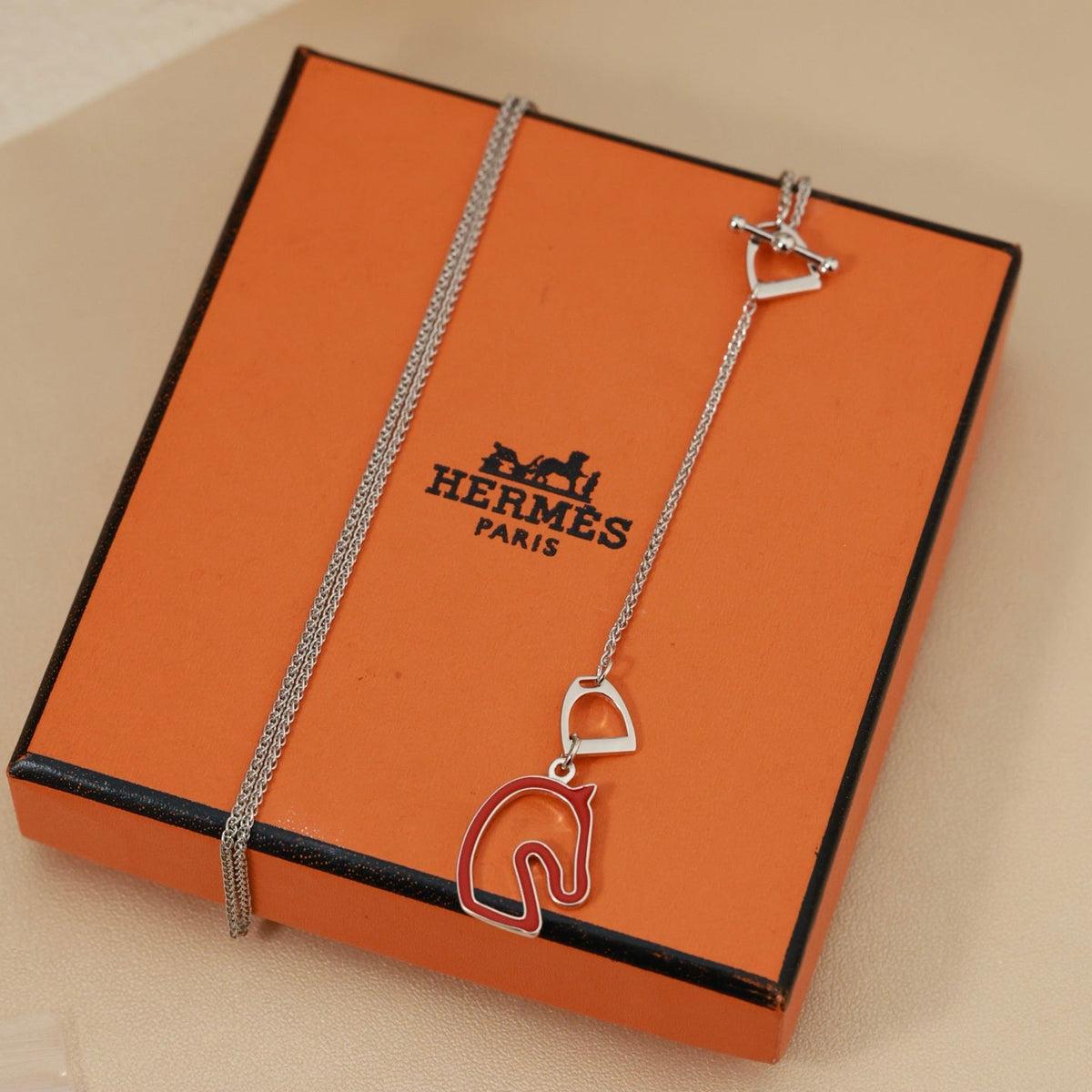 Martin Graham pendant necklace in polished metal-tone – close-up detail