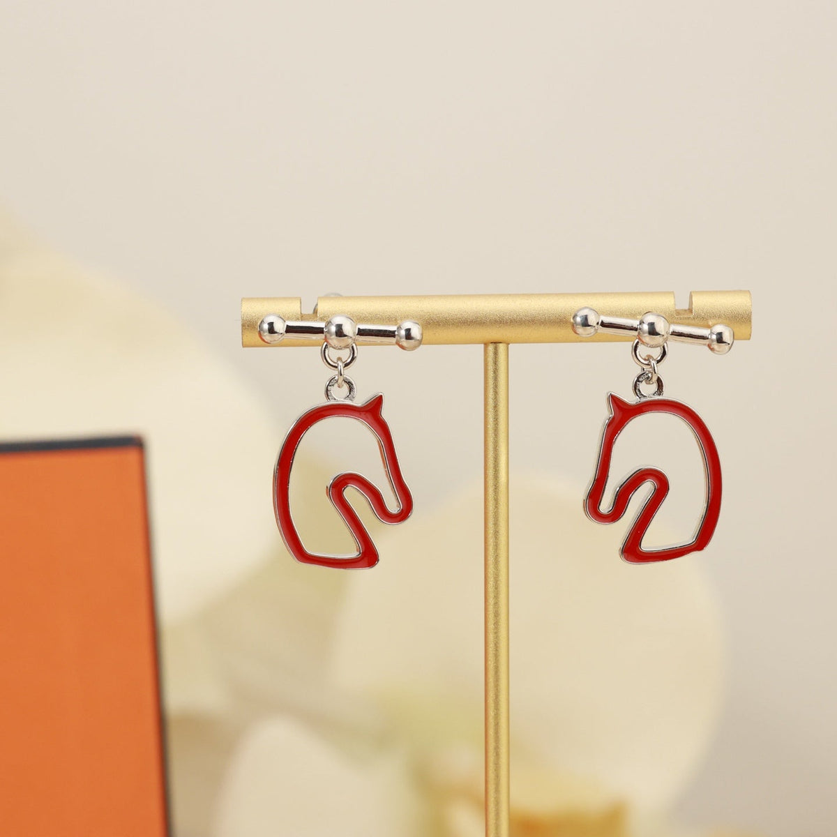 Martin Graham stud earrings in polished metal-tone – side detail