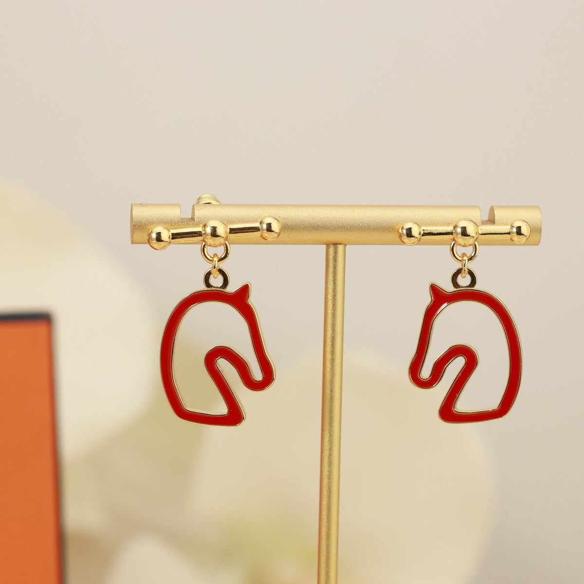 Martin Graham stud earrings in polished metal-tone – styled product view