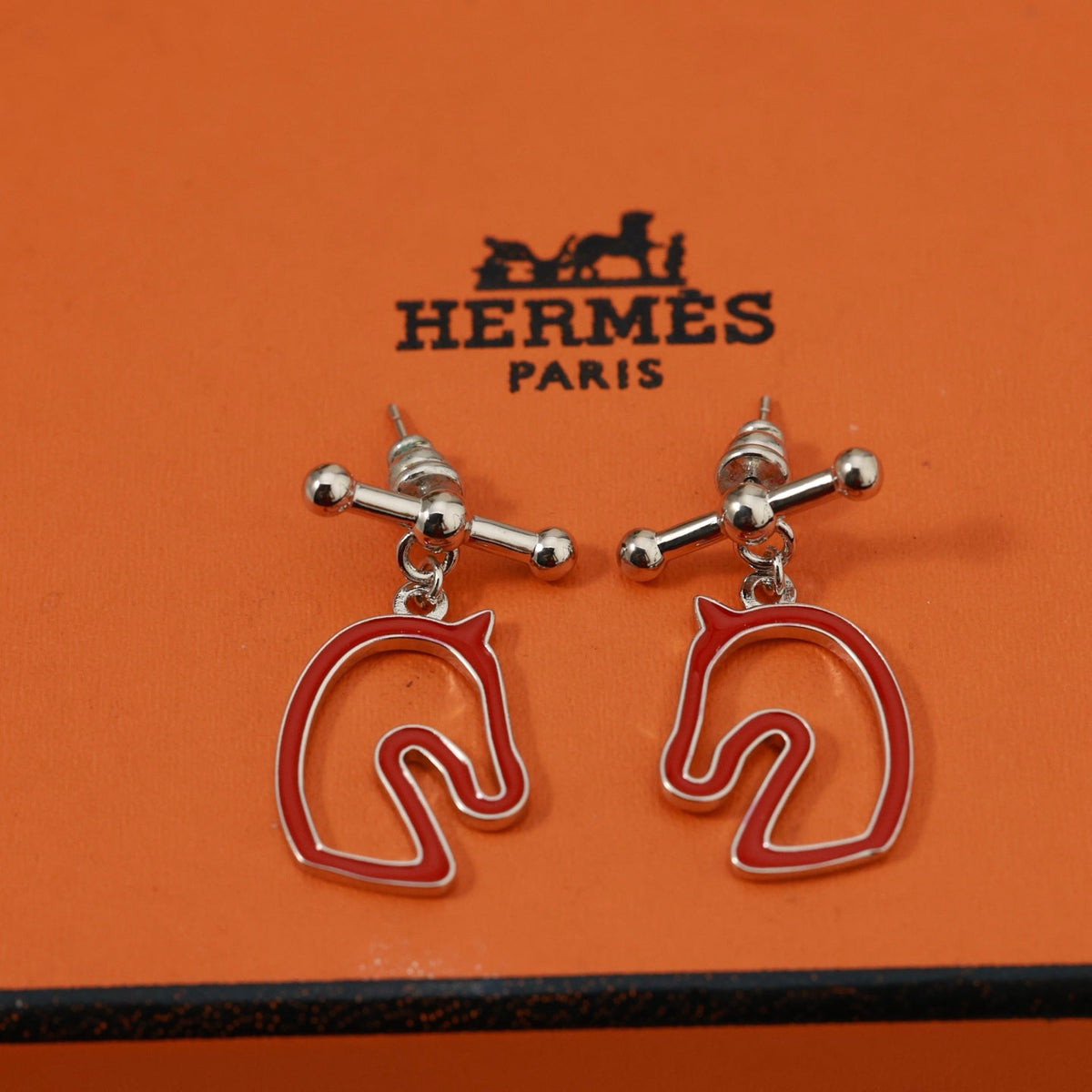 Martin Graham stud earrings in polished metal-tone – front product view