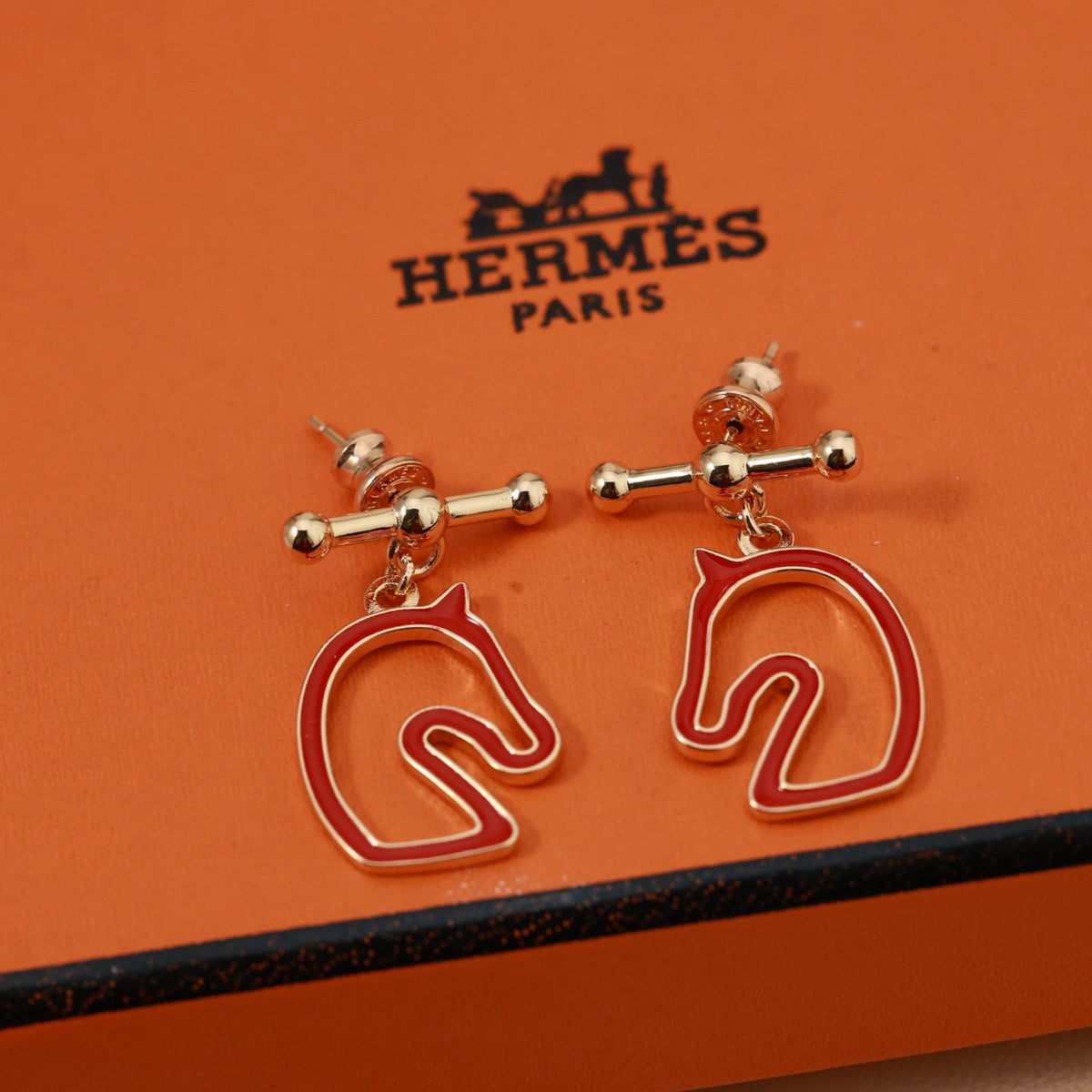 Martin Graham stud earrings in polished metal-tone – detail view