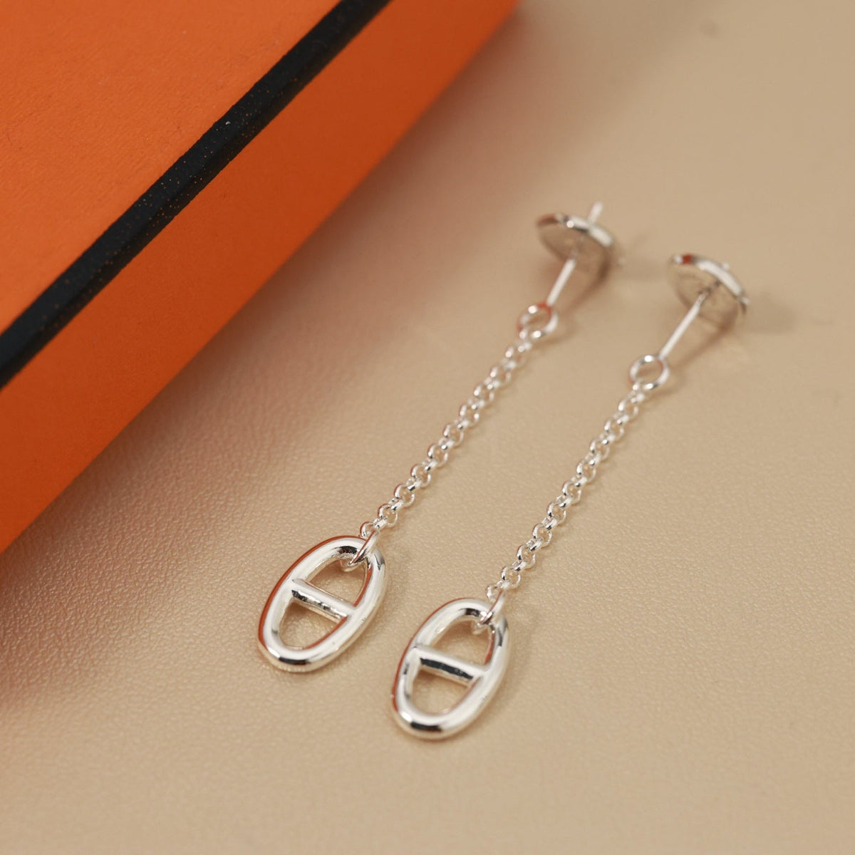 Martin Graham stud earrings in polished metal-tone – side detail