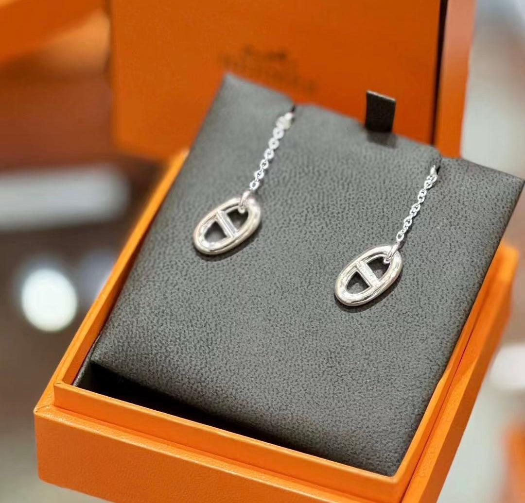 Martin Graham stud earrings in polished metal-tone – front product view