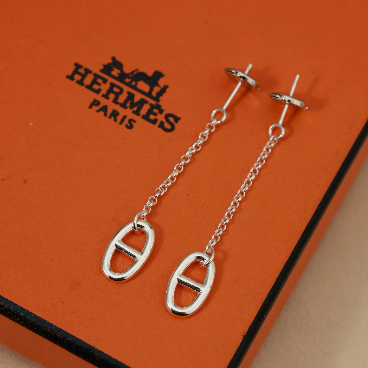 Martin Graham stud earrings in polished metal-tone – front product view