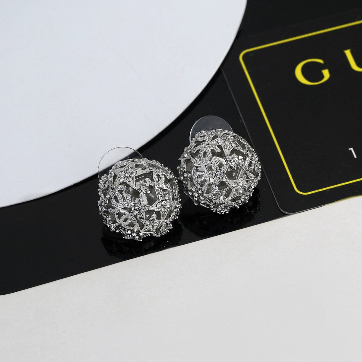 Martin Graham stud earrings in polished metal-tone – side detail