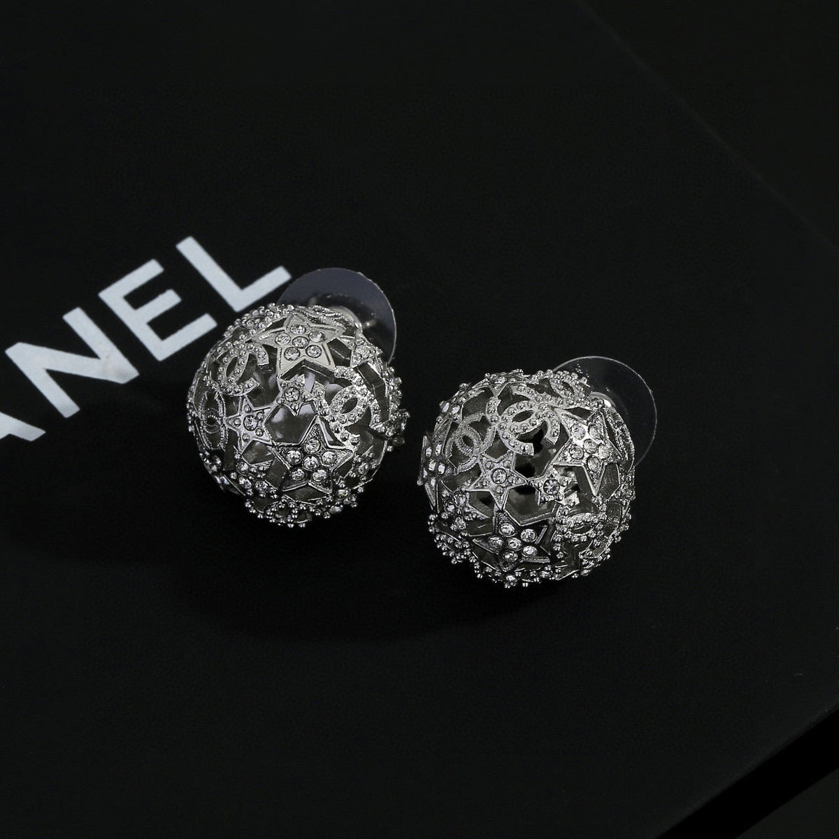 Martin Graham stud earrings in polished metal-tone – detail view